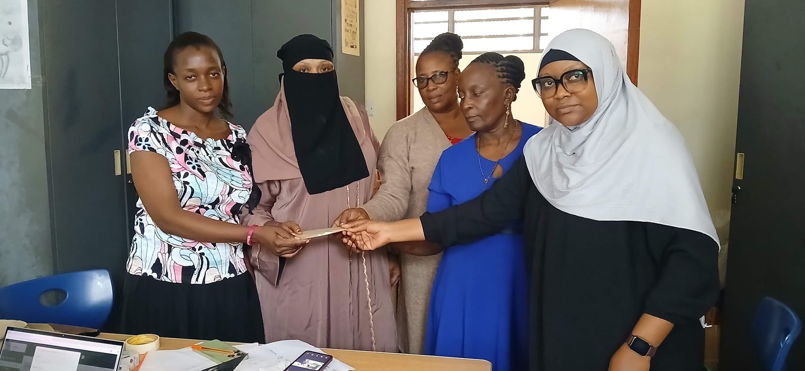 Partnership handover with members of the Beautiful Minds Network team